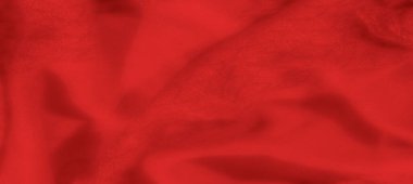 Yumuşak kıvrımlı ve yumuşak parıltılı bulanık kırmızı kumaş, dokulu ve sıcak bir his veriyor. Gölgeler bu tekstilin lüks ve zarif görünümünü arttırır..