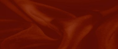 Canlı kırmızı kumaş kıvrımları, sıcak, zarif ve görsel olarak dinamik bir zemin oluşturmak için mükemmel, pürüzsüz ve lüks bir doku sergiliyor..