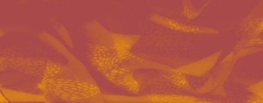 Karmaşık tasarım desenleri olan akışkan sarı kumaş bulanıklığı. Yumuşak kıvrımlar ışığı çok güzel yakalıyor, lüks iç temalar için ideal zarif, rahat bir doku yaratıyor..