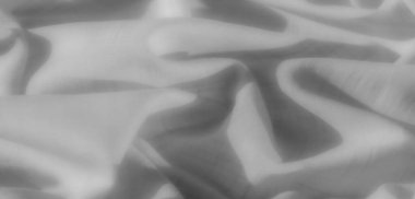 Görüntü. İnce dalgalar ve kıvrımlarla donatılmış karmaşık detaylar içeren gri ölçekli bir kumaş girdabı karmaşık ve zamansız bir estetik için..