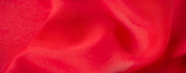 Görüntü: Kırmızı kumaşın dinamik kıvrımlı ve nazik röflelerle yakın çekimi, yaratıcı projelere canlı ve dokulu bir zemin eklemek için ideal.