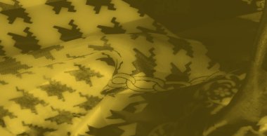 Bulanık efekt, modern tekstil estetiği için ideal geometrik şekillerin ve bağlı zincir tasarımlarının dinamik düzeninin yer aldığı parlak sarı bir kumaşı vurgular..