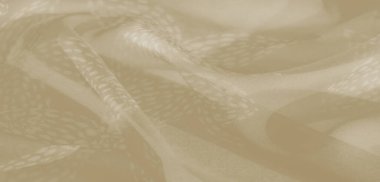 Yumuşak, kıvrımlı kıvrımlı bej kumaşlı bulanık yakın plan ve çiçeğe benzer narin desenler. Nazik dokusu ince ve ince bir kalite katar, arka plan için mükemmeldir..