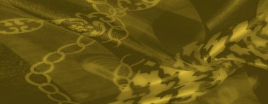 Görüntü, parlak dokular ve kalın geometrik tasarımların birleşimi, bu sarı kumaş lüksün sanatsal bir temsili, onu yaratıcı ve yüksek moda projeleri için mükemmel kılıyor..