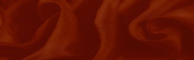 Bulanık kırmızı kumaş pürüzsüz kıvrımlar ve pürüzsüz dokular içeriyor, zarafet saçıyor. Cesur tonları onu onu sanatsal ya da modern görsel kavramlar için mükemmel bir seçim yapıyor..