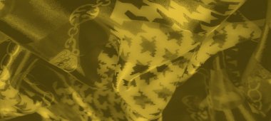 Detaylı zikzak ve birbirine dolanmış zincir desenli bulanık sarı kumaş. Doku kıvrımları dinamik ve sofistike görünümü geliştirir..