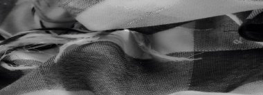 Görüntü - Gri tonlu kumaş sanatsal kıvrımları ve ince dokusu var. Narin dokusuna yakın çekim tasarım ve sadeliğin büyüleyici bir karışımını yaratır..