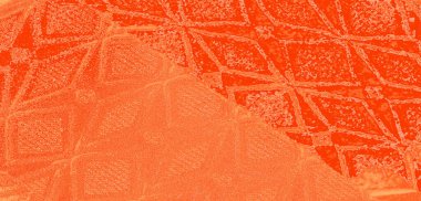 Karmaşık geometrik desenleri ve su damlacıkları olan turuncu dokuya yakın çekim bulanık görüntü. Kumaş parlak görünümlü canlı ve zengin bir renk sergiliyor..