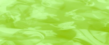 Havadar çiçek desenli ve ince çizgili limon yeşili kumaş, dinamik ve ferahlatıcı bir görsel cazibe sunuyor parlak, hafif kıvrımlarıyla