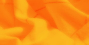 Yumuşak turuncu ve sarı kumaştan oluşan kıvrımlı kıvrımlar, canlı tonlarla vurgulanmış ve dokulu detaylar, sıcak ve enerjik soyut bir zemin oluşturuyor.