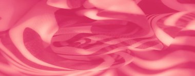 Kalın, dalgalı çizgili desenleri ve yumuşak kıvrımları olan parlak pembe kumaşlar. Katıksız malzeme, tasarıma zarafet ve hareket hissi ekler..