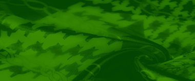 Bulanık yeşil kumaş, dinamik zincir halkaları ve kalın houndstooth desenleri. Bu canlı tekstil moda veya dekor için zarif ve çağdaş bir büküm sunar.