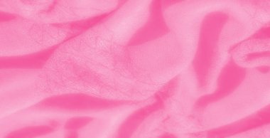 Yumuşak dalgalı desenli bulanık pembe kumaş, pürüzsüz dokuları ve katmanlı kıvrımları var. Pastel renk sakin bir atmosfer yaratır, arka plan ve yaratıcı tasarım projeleri için idealdir..