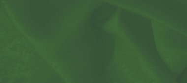 Katmanlı yeşil kumaşın dinamik kıvrımları ve ipeksi dokusu, canlı tonların birleşimi ve sanatsal, modern bir sunum için kusursuz bir akış..