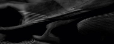 Görüntü. Pürüzsüz, üst üste binen ve çarpıcı çizgili desenleri olan gri pullu bir kumaş, her tasarım projesi için lüks ve modern bir estetik yaratıyor..