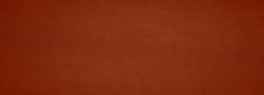 Yumuşak dalgaları ve zarif parıltısı olan koyu kırmızı bir kumaşın bulanık dokusu, tekstil ve arka planlara lüks bir dokunuş ekler.