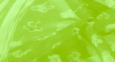 Görüntü. Zarif çiçek desenli çarpıcı yeşil bir kumaş. Parlak bir yüzey ve akış katları sergiliyor. Dekoratif ve şık tekstil tasarımları için ideal..