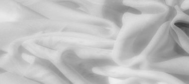 Görüntü. Karmaşık kıvrımlı beyaz kumaş ve ince ışık ve gölge efektleri yumuşak, soyut bir görünüş için dinamik ve dokulu bir yüzey oluşturur..