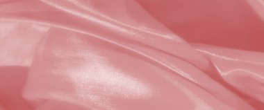 Bulanık pembe kumaş perdeleri ipeksi bir doku ve ince parlak parlak ışıklar, yumuşak dalgalar oluşturur ve pürüzsüz ve lüks bir görünüm için kıvrılır..