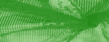 Bulanık zümrüt yeşili kumaş parlak parıltılı ince geometrik desenler tasarım amaçları için sofistike ve dinamik bir görsel cazibe sağlıyor..