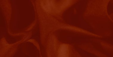 Görüntü. Yumuşak kıvrımlı ve karmaşık desenleri olan koyu kırmızı bir kumaş. Yumuşak malzeme ve canlı tonlar çeşitli yaratıcı tasarımlar için çarpıcı bir zemin oluşturur..