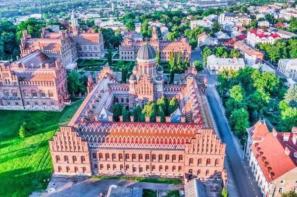 Aerial view of Chernivtsi National University named after Yuriy Fedkovych, the residence of seminars and the Church of the Three Saints. Old historical university building with towers, domes and green garden Chernivtsi, Ukraine