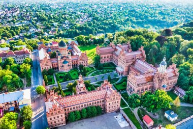 Aerial view of Yuriy Fedkovych National University, Seminar Residence and Church of the Three Hierarchs. Old historical university building with towers, domes, and green garden Chernivtsi, Ukraine