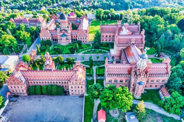 Aerial view of Yuriy Fedkovych National University, Seminar Residence and Church of the Three Hierarchs. Old historical university building with towers, domes, and green garden Chernivtsi, Ukraine