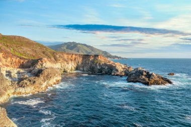 Beautiful landscape of Pacific Ocean coast along Highway 1 and Big Sur, aerial view, sunset, sunrise, fog. Concept, travel, vacation, weekend. clipart