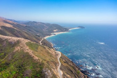 Beautiful landscape of Pacific Ocean coast along Highway 1 and Big Sur, aerial view, sunset, sunrise, fog. Concept, travel, vacation, weekend. clipart