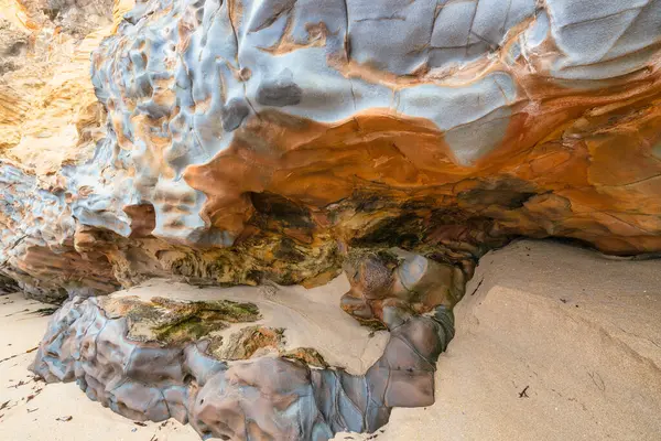 stock image Full frame of sandstone cliff drawing, rock formation, natural sandstone on beach in california, lines and curves of stone used for background.