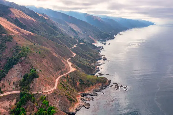 stock image Highway 1 and Big Sur along the Pacific Ocean coast, beautiful landscape and aerial view, sunset, sunrise, fog. Concept, travel, vacation, weekend.