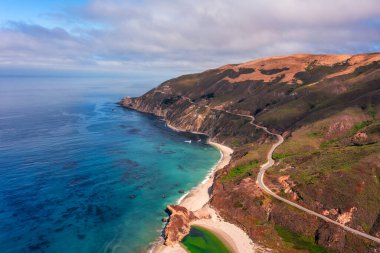 Highway 1 and Big Sur along the Pacific Ocean coast, beautiful landscape and aerial view, sunset, sunrise, fog. Concept, travel, vacation, weekend. clipart