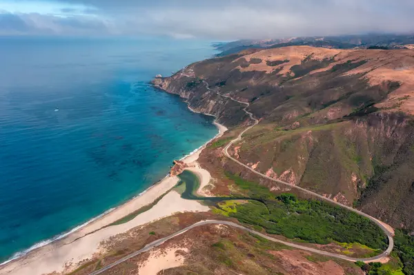 stock image Highway 1 and Big Sur along the Pacific Ocean coast, beautiful landscape and aerial view, sunset, sunrise, fog. Concept, travel, vacation, weekend.