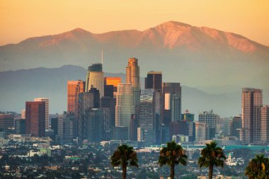 A stunning nighttime view downtown Los Angeles, with a glowing full moon and twinkling city lights. The scene captures the essence of Hollywood stars against the iconic urban skyline clipart