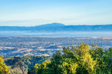 A breathtaking view in the mountains above Silicon Valley, perfect for hikers and travelers. The vibrant colors and picturesque landscape inspire exploration and adventure. clipart