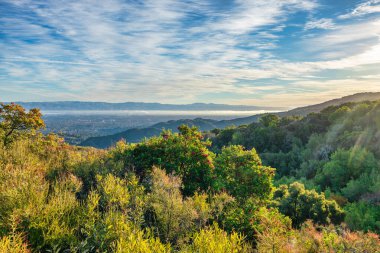 A breathtaking view in the mountains above Silicon Valley, perfect for hikers and travelers. The vibrant colors and picturesque landscape inspire exploration and adventure. clipart