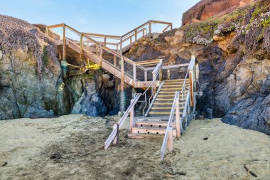 A beautiful view of the stairs that lead to Malpaso Creek Beach on the Pacific coast, of California along State Road 1 clipart