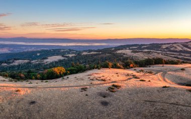 Breathtaking, beautiful sunrise view in mountains Silicon Valley, dreamy backdrop for trekking enthusiasts. Travel moment captures natures harmony and the allure of morning light in California's hills clipart