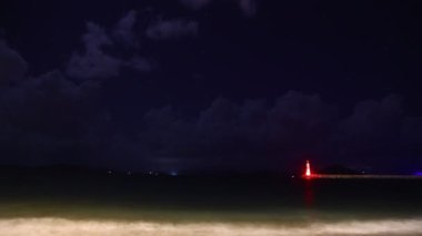 A beach under the stars. with night storm clouds.