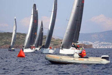Bodrum,Turkey. 14 January 2023: Sailboats sail in windy weather in the blue waters of the Aegean Sea, on the shores of the famous holiday destination Bodrum.