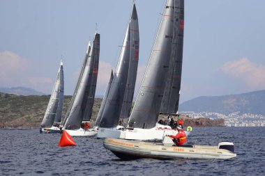 Bodrum,Turkey. 14 January 2023: Sailboats sail in windy weather in the blue waters of the Aegean Sea, on the shores of the famous holiday destination Bodrum.