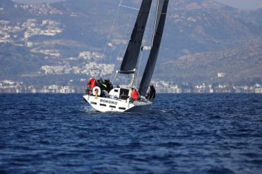 Bodrum,Turkey. 14 January 2023: Sailboats sail in windy weather in the blue waters of the Aegean Sea, on the shores of the famous holiday destination Bodrum.
