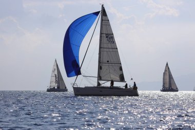 Bodrum,Turkey. 14 January 2023: Sailboats sail in windy weather in the blue waters of the Aegean Sea, on the shores of the famous holiday destination Bodrum.