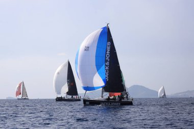 Bodrum,Turkey. 14 January 2023: Sailboats sail in windy weather in the blue waters of the Aegean Sea, on the shores of the famous holiday destination Bodrum.