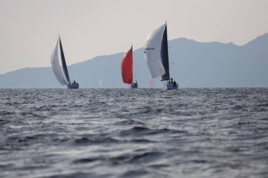 Bodrum,Turkey. 14 January 2023: Sailboats sail in windy weather in the blue waters of the Aegean Sea, on the shores of the famous holiday destination Bodrum.