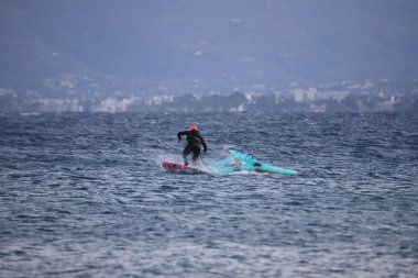 Bodrum, Mugla, Turkey. 30 January 2023 : An athlete doing windsurfing in the Aegean Sea.