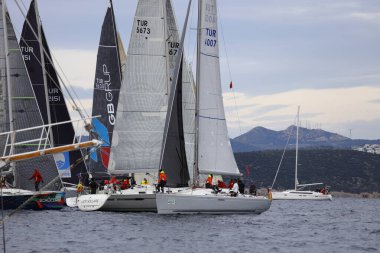Bodrum,Turkey. 04 February 2023: Sailboats sail in windy weather in the blue waters of the Aegean Sea, on the shores of the famous holiday destination Bodrum.
