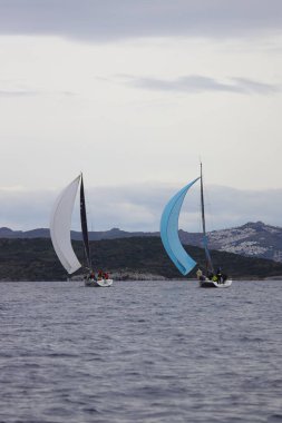 Bodrum,Turkey. 04 February 2023: Sailboats sail in windy weather in the blue waters of the Aegean Sea, on the shores of the famous holiday destination Bodrum.