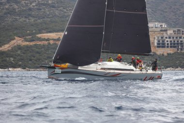 Bodrum,Turkey. 05 February 2023: Sailboats sail in windy weather in the blue waters of the Aegean Sea, on the shores of the famous holiday destination Bodrum.